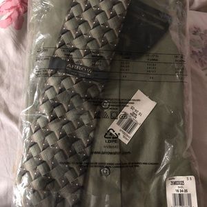 Men’s long sleeve dress shirt with tie.